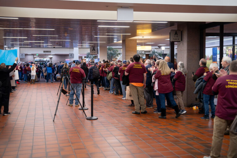 Ryan Londregan Hearing Supporters, Hennepin County Center 3 Supporters of Minnesota State Trooper Ryan Londregan gather at the Hennepin County Government Center in Downtown Minneapolis. They are present for a court hearing concerning Londregan, who is accused of killing Ricky Cobb II during a traffic stop in July. Many attendees wear shirts expressing solidarity with the State Trooper. The Hennepin County Government Center, completed in 1974, serves as the primary administrative and judicial facility for Hennepin County, housing district courts and county offices. This gathering highlights public interest and divisions surrounding the ongoing trial.
