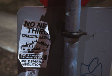A flyer opposing a new Minneapolis police third precinct station. The city will be rebuilding the station that was burned down during protest over George Floyd's murder.