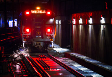 Sparks under a Forest Hills Orange Line train in Boston.