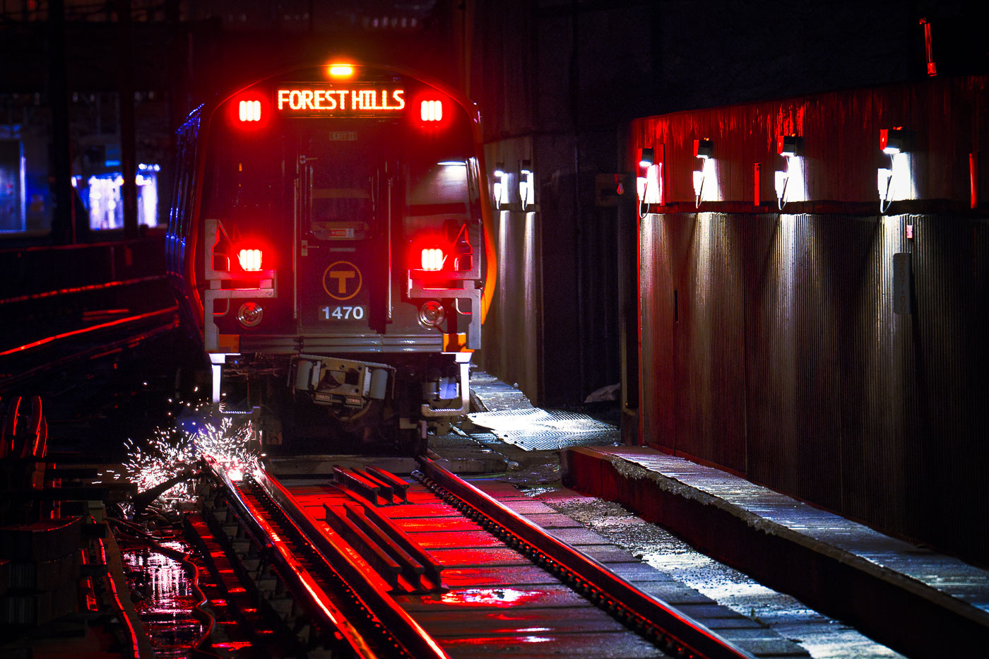 Sparks under a Forest Hills subway train in Boston