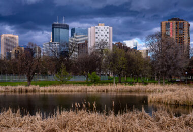 Storm clouds roll over Minneapolis as seen from Loring Pond near Downtown.