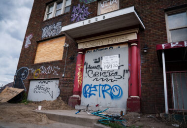 A sign on the front of the "Dundry House" in Minneapolis. It reads "this building will be demolished May 20". The building was destroyed by fire in April 2024. The building had been vacant.
