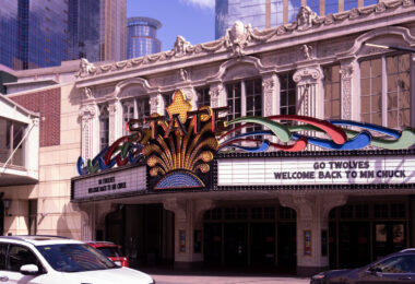 "GO TWOLVES" and "WELCOME BACK TO MN CHUCK" on the marquee of the State Theatre in downtown Minneapolis.