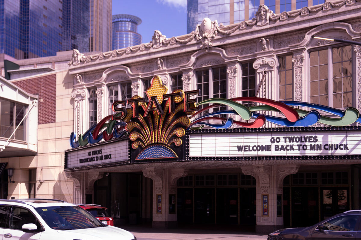 "GO TWOLVES" and "WELCOME BACK TO MN CHUCK" on the marquee of the State Theatre in downtown Minneapolis.