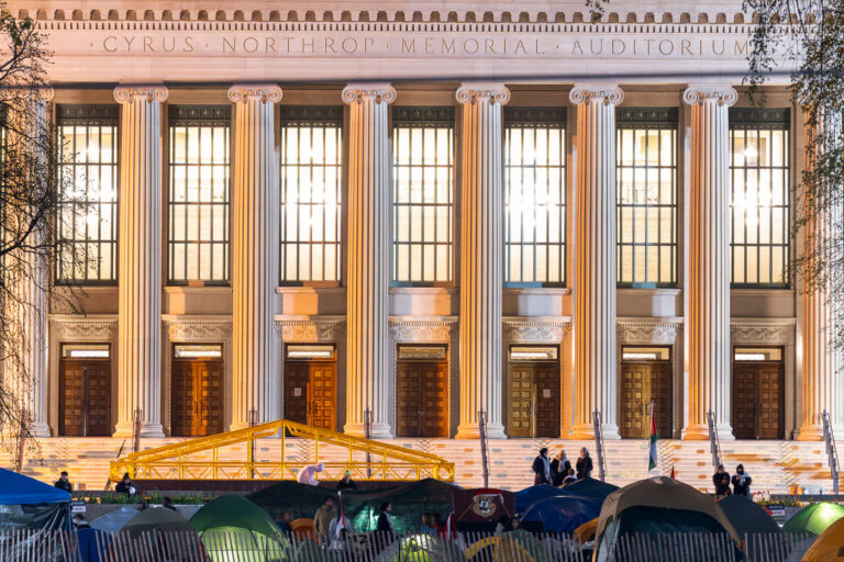 Northrup Auditorium with protest encampment 3 The anti-war protest encampment at the University of Minnesota in Minneapolis on May 1st, 2024. At the same time, some protesters were continuing to talk with school officials regarding their demands. Shortly after 10pm the school sent out a message that an initial agreement had been reached. Tents were removed on May 2nd.This is the second encampment at the university following the police clearing and arresting 9 protesters last week. Among the protesters demands are that the school “divest from all companies complicit in war crimes and human rights violations.