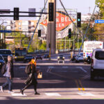 Walking across Hennepin Avenue in Downtown Minneapolis.