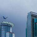 An Alaskan Airlines plane flies over Downtown Minneaopolis.
