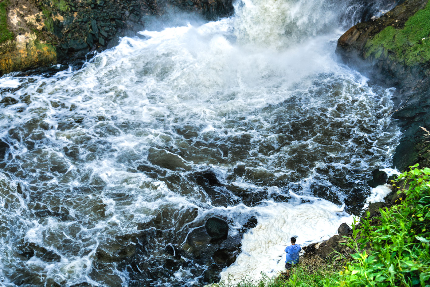 Fisherman at Minnehaha Falls in June 2024