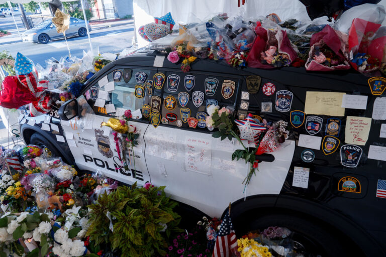Jamal Mitchell Squad Car Memorial 4 Memorial for Minneapolis officer Jamal Mitchell. Mitchell was killed in a mass shooting on May 30th, 2024 while responding.