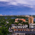 Downtown Minneapolis as seen from Southwest Minneapolis. Lake of the Isles and Bde Maka Ska in the foreground.