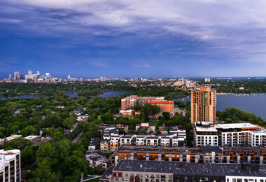 Downtown Minneapolis as seen from Southwest Minneapolis. Lake of the Isles and Bde Maka Ska in the foreground.