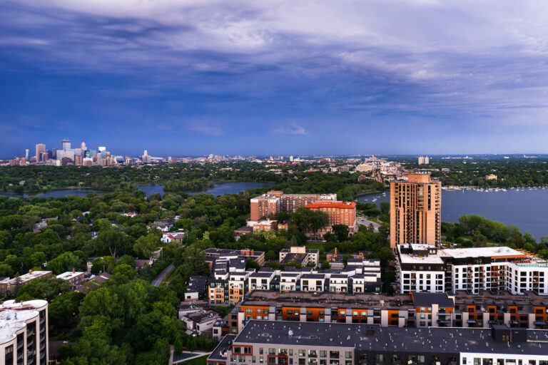 Downtown Minneapolis as seen from Southwest Minneapolis. Lake of the Isles and Bde Maka Ska in the foreground.