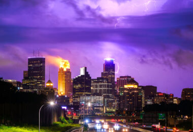 A lightning bolt hits downtown Minneapolis as storms move to the north of the city.