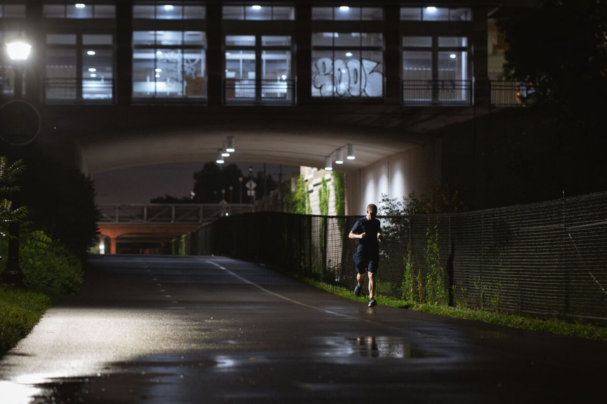A jogger on the Midtown Greenway after rain moves through the area. The Greenway runs through South Minneapolis.