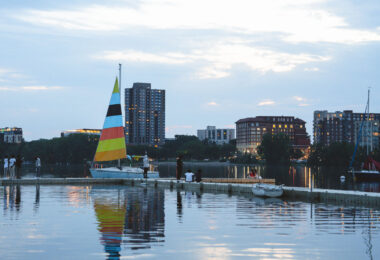 People watch the susnet from Bde Maka Ska in Minneapolis.