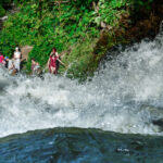 Visitors at the bottom of Minnehaha Falls in Minneapolis in June 2024.