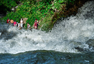 Visitors at the bottom of Minnehaha Falls in Minneapolis in June 2024.