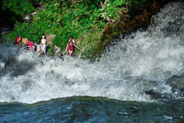 Minnehaha Falls Visitors June 2024 1 Visitors at the bottom of Minnehaha Falls in Minneapolis in June 2024.