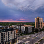 Lake Street and Excelsior Blvd near the western edge of Minneapolis during a June sunset. Waterbury House on the left where rent ranges from ,495 to ,995 a month. The apartment building on the triangle lot replaced a long standing BP gas station.
