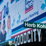 Fox News banner behind a Herb Kohl Way sign outside Fiserv Forum.