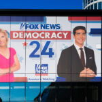 A Fox News banner with Laura Ingraham and Watters on it outside the 2024 Republican National Convention.