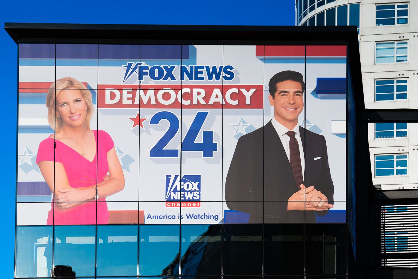 A Fox News banner with Laura Ingraham and Watters on it outside the 2024 Republican National Convention.