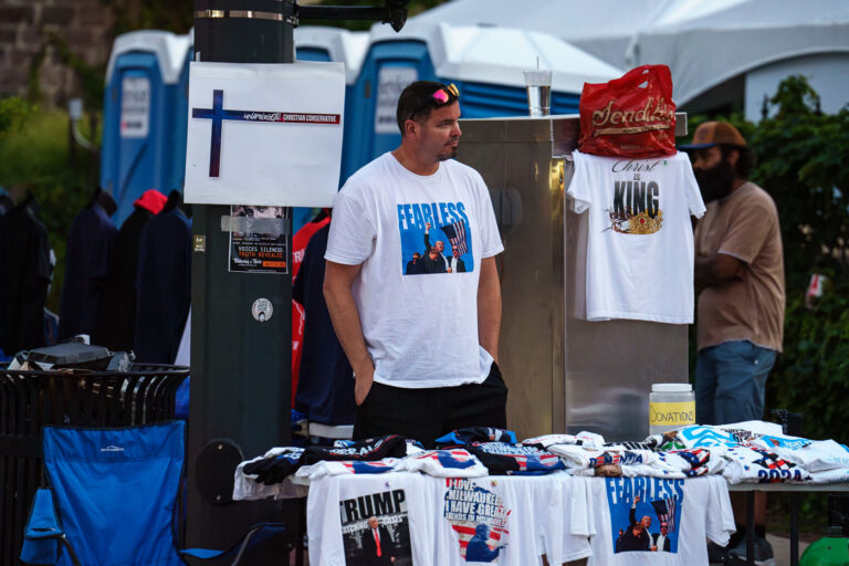 2024 RNC Vendor selling Trump post assassination attempt shirt 4 A vendor at the 2024 Republican National Convention selling t-shirts with a photo of Trump following an assassination attempt days prior.