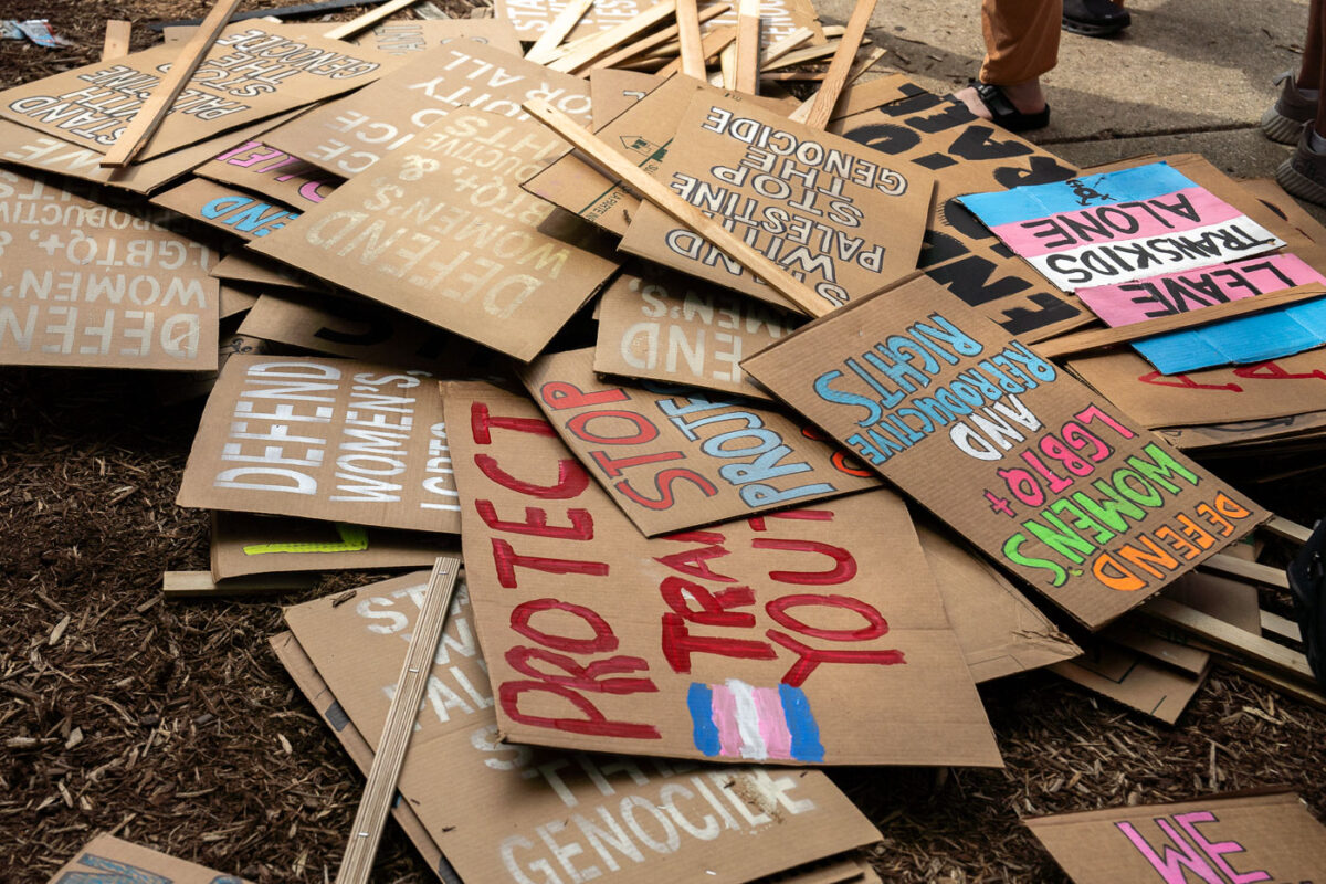 A pile of protest signs after a march around the 2024 Republican National Convention in Milwaukee.