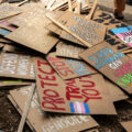 A pile of protest signs after a march around the 2024 Republican National Convention in Milwaukee.