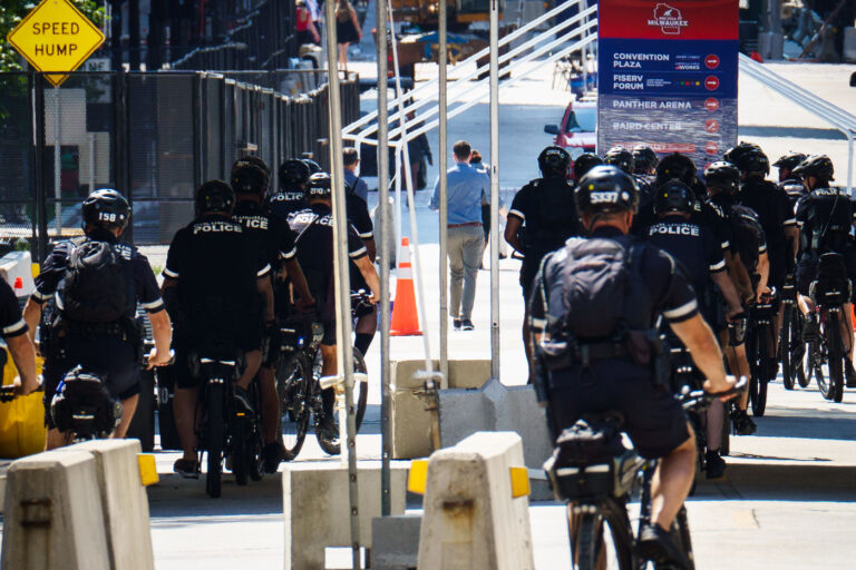 Bicycle Police Units Mobilized for RNC Security Around Downtown 1 Police officers from the Columbus Division of Police and other regional departments patrol in formation near the Fiserv Forum during the Republican National Convention in July 2024. Bicycle units provided mobility through fenced and pedestrian-only zones, allowing for rapid deployment along protest routes and access corridors. These coordinated movements were part of the large multi-agency presence tasked with maintaining safety during demonstrations and convention proceedings.