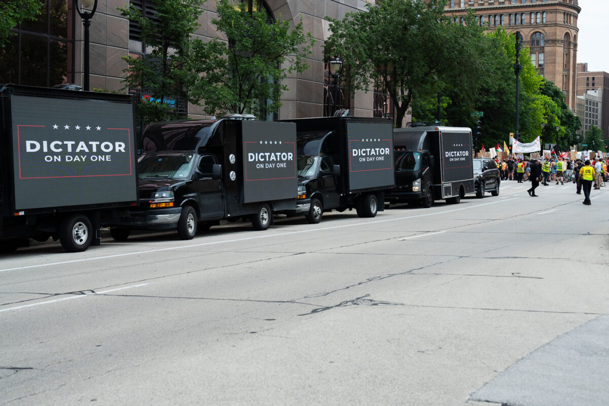 Video boards on trucks that read "Dictator on Day One" outside the Republican National Convention in Milwaukee.
