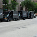 Video boards on trucks that read "Dictator on Day One" outside the Republican National Convention in Milwaukee.