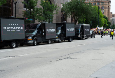 Video boards on trucks that read "Dictator on Day One" outside the Republican National Convention in Milwaukee.