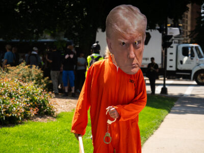 Protester in Trump Mask and Handcuffs at 2024 RNC, Milwaukee