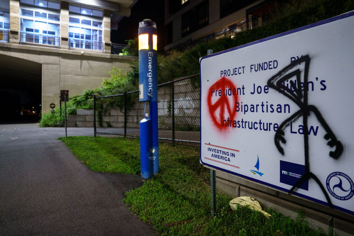 President Joe Biden's Bipartisan Infrastructure Law sign on the Midtown Greenway in Uptown Minneapolis.