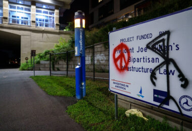President Joe Biden's Bipartisan Infrastructure Law sign on the Midtown Greenway in Uptown Minneapolis.