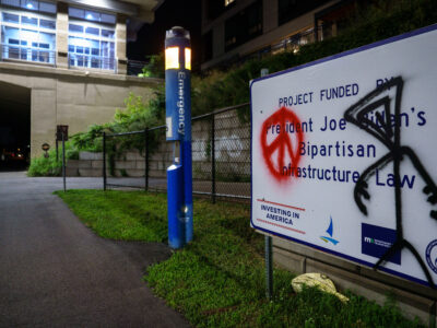 Midtown Greenway Sign Vandalized: Biden Infrastructure Law