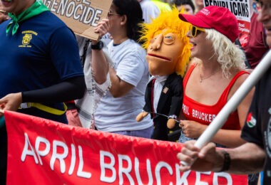 Las Vegas ventriloquist April Brucker and her puppet “Donald J. Tramp” marching at the 2024 Republican National Convention.