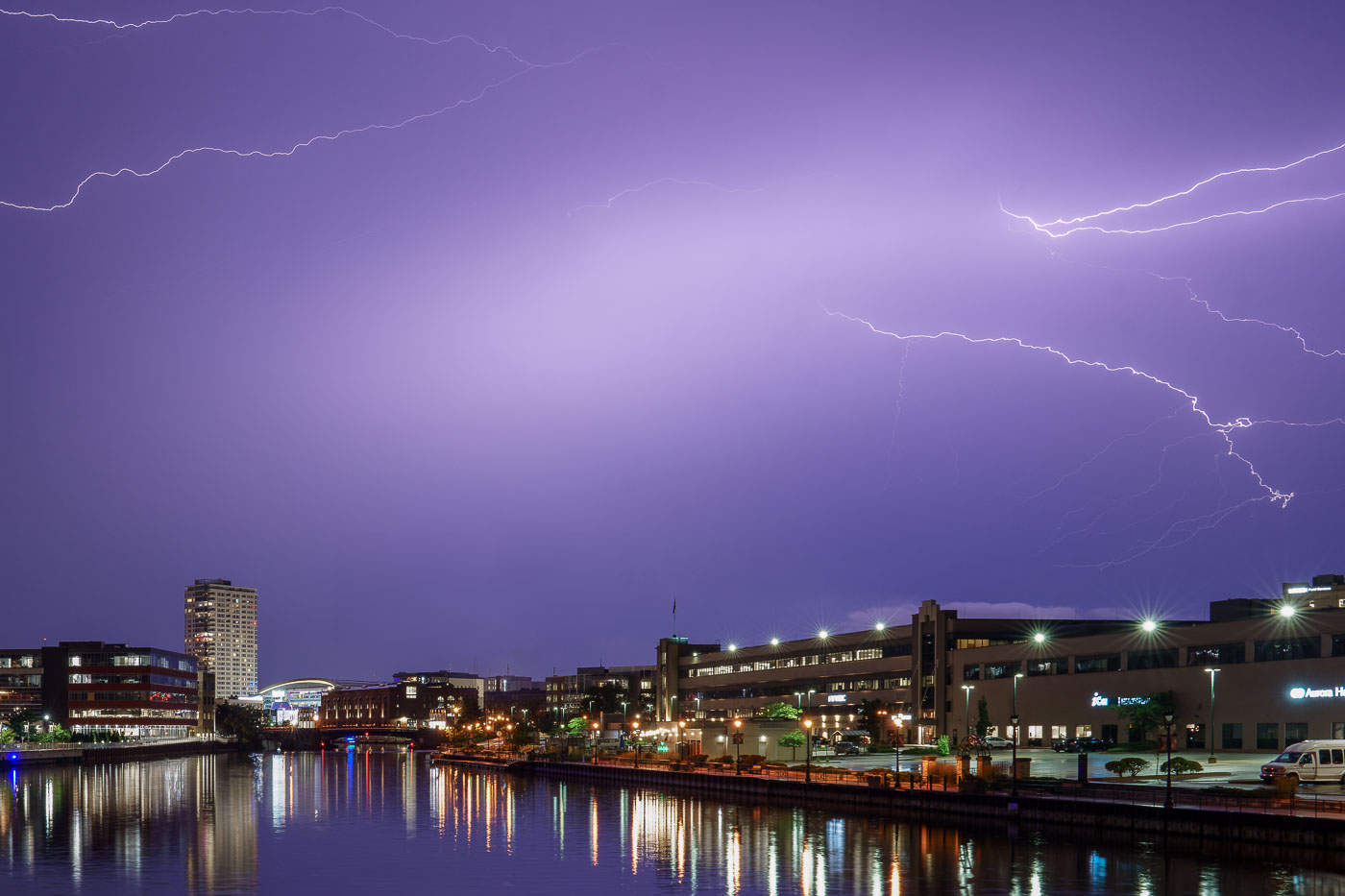 Lightning hits Fiserv Forum in Milwaukee tonight as former President Trump makes an appearance at Day 1 of the 2024 Republican National Convention. With a bandage on his ear following an assassination attempt 2 days ago, he appeared for the first time with chosen VP, J.D. Vance.