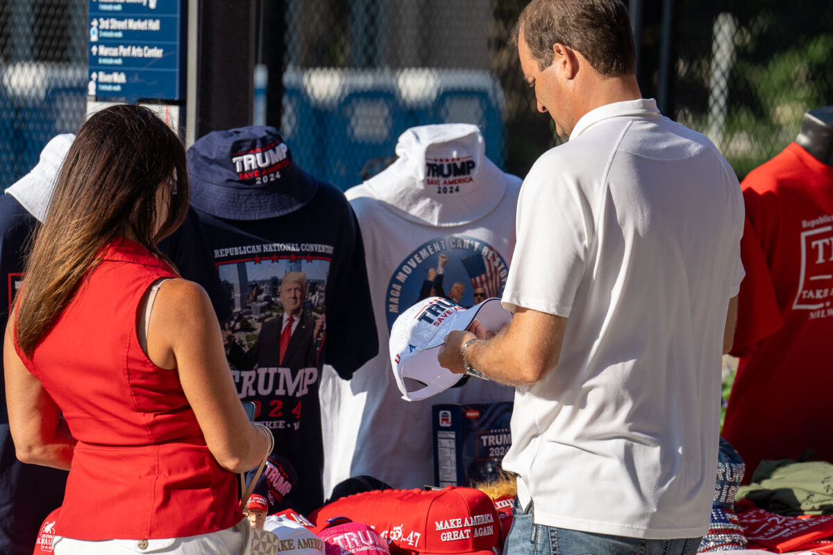 A couple stop to purchase MAGA apparell outside the RNC in Milwaukee.