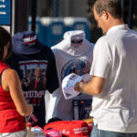 A couple stop to purchase MAGA apparel outside the RNC in Milwaukee.