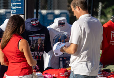A couple stop to purchase MAGA apparel outside the RNC in Milwaukee.