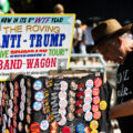 A man sells pins from his cart that he calls The Roving Anti-Trump "Save Democracy Tour!" Band-Wagon outside the Republican National Convention.