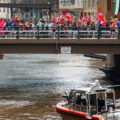 March On the RNC marching over the Milwaukee River near the 2024 Republican National Convention