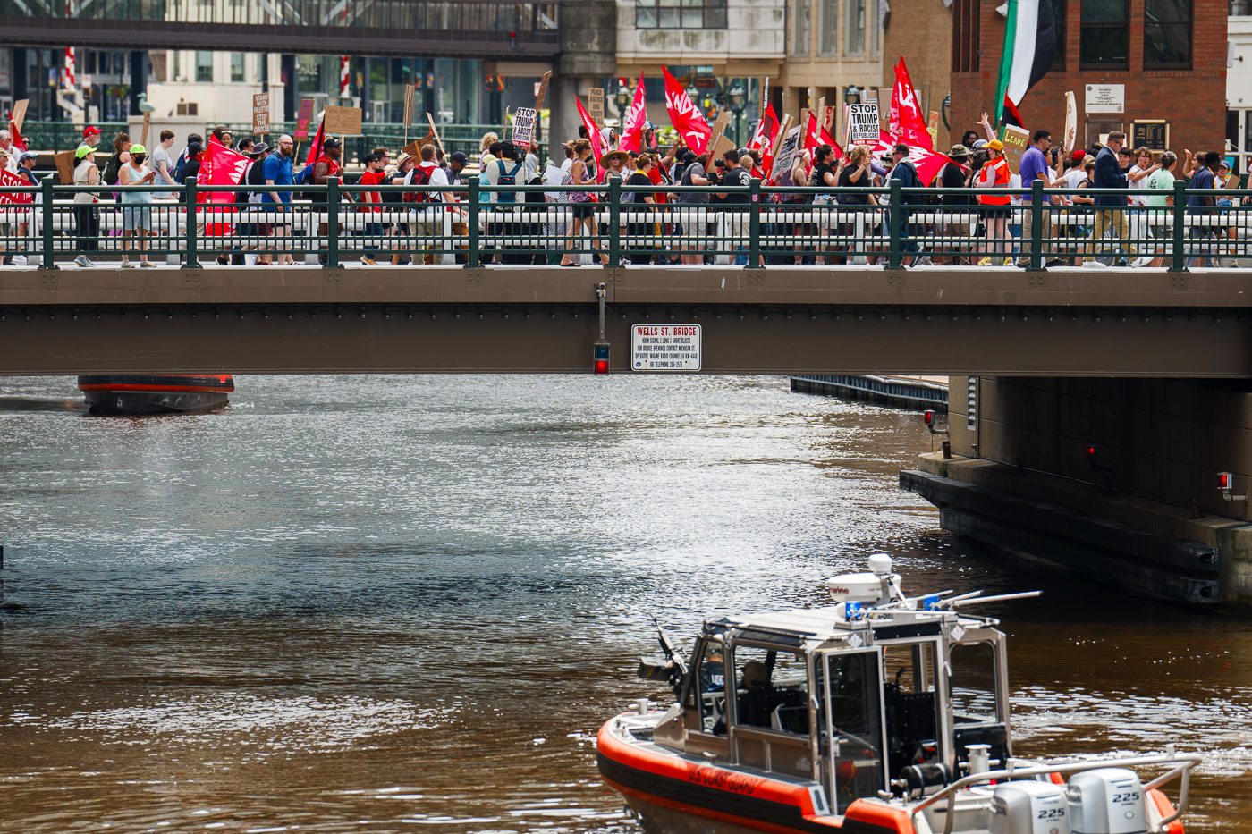 March On the RNC marching over the Milwaukee River near the 2024 Republican National Convention