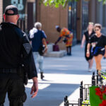 An officer with the Massachusetts State Police walks down the sidewalk in Milwaukee during the 2024 Republican National Convention.