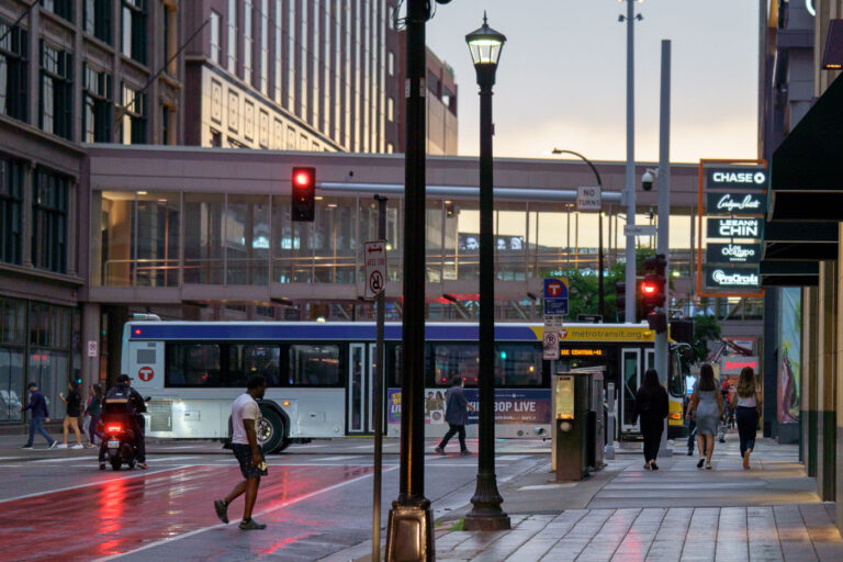 Metro Transit Bus at Nicollet Mall July 2024 3 People walking in downtown Minneapolis as a Metro Transit bus moves down Nicollet Mall.