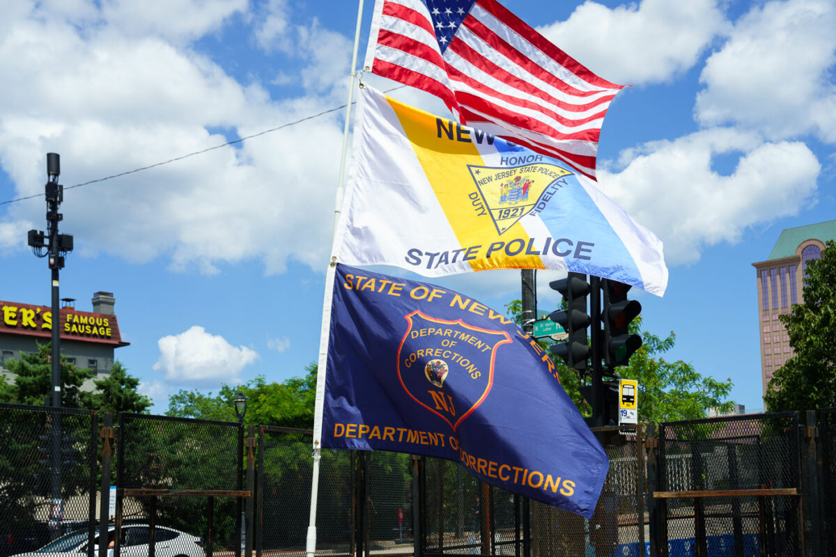 New Jersey State Police and New Jersey Department of Corrections flags flying at a security checkpoint at the 2024 Republican National Convention in Milwaukee.