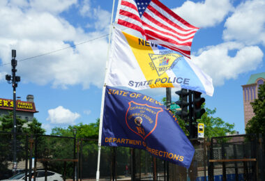 New Jersey State Police and New Jersey Department of Corrections flags flying at a security checkpoint at the 2024 Republican National Convention in Milwaukee.