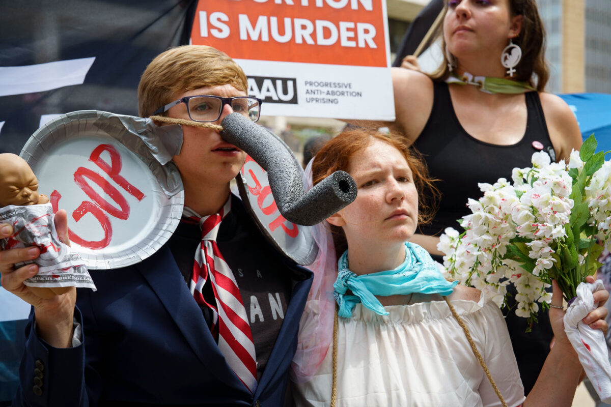 Protesters from the Progressive Anti-Abortion Uprising organization at the 2024 Republican National Convention in Milwaukee.